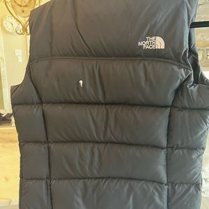 North Face Down Vest Size M. Small hole in back.